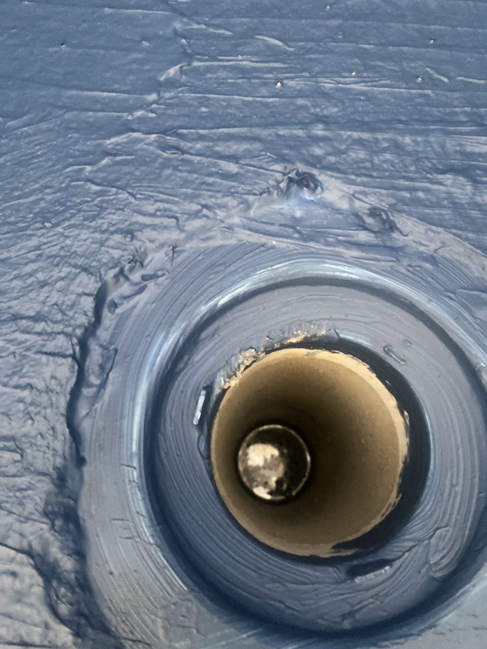 Membrane not fully wrapping the puddle flange at the floor waste, found during a waterproofing inspection in Pennant Hills