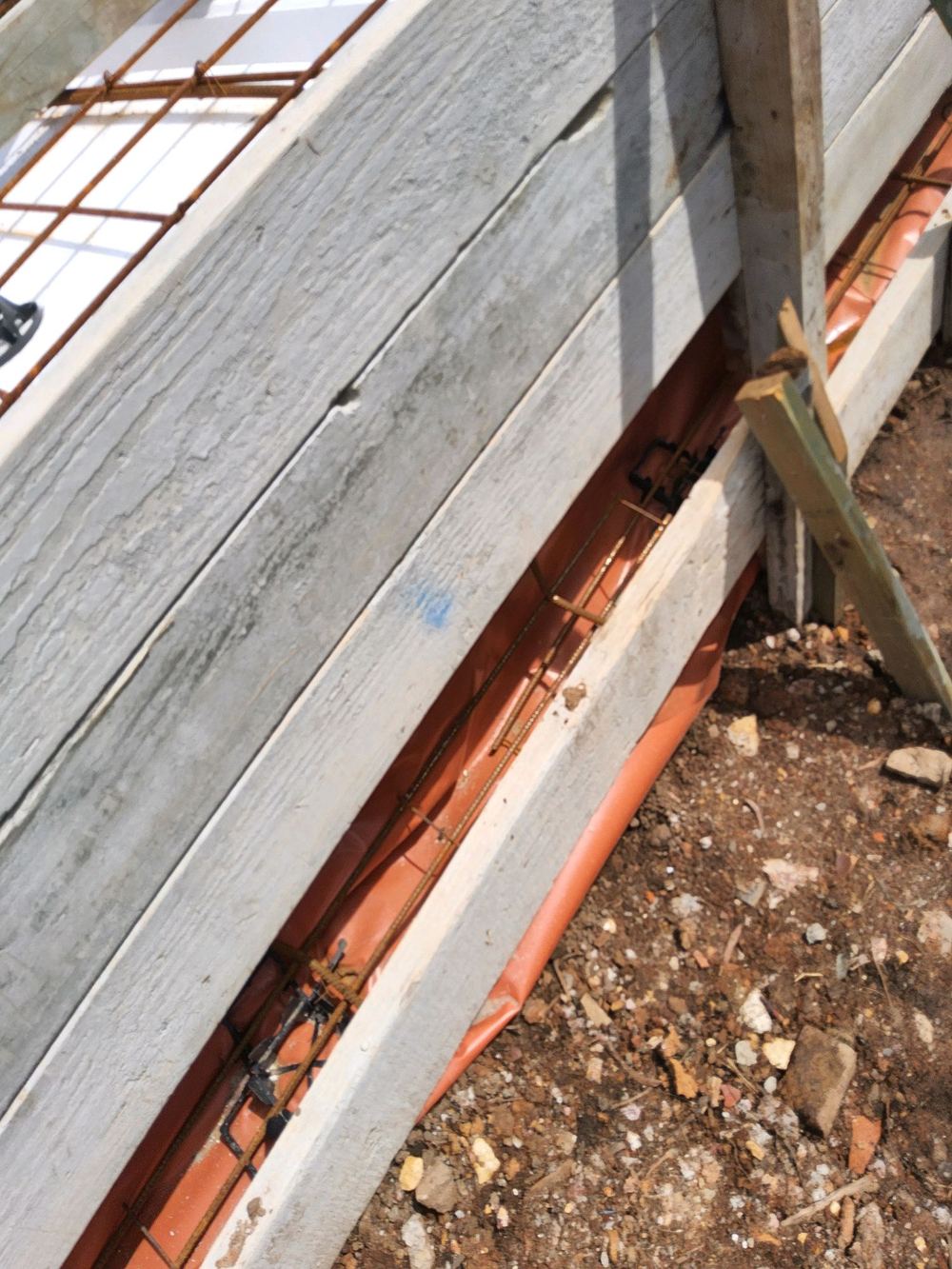Stepped footing formwork needing proper support before concrete, found during a slab pre-pour inspection in Pennant Hills
